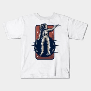 Astronaut on a planet Kids T-Shirt